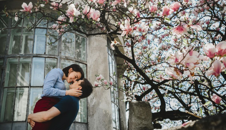 lovely-young-couple-stands-blooming-tree-outside-hug-each-other-tender